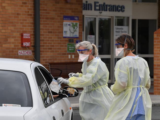 Staff at the Caloundra fever clinic testing people for the coronavirus. Photo: John McCutcheon