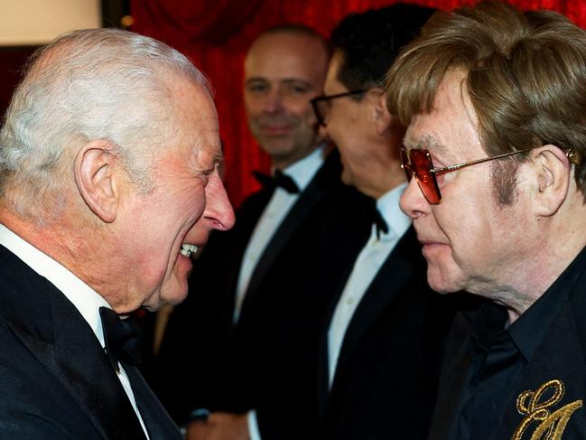 Britain's King Charles III meets Elton John as he attends the Royal Variety Performance at the Royal Albert Hall in London on November 22, 2024. The Royal Variety Performance takes place every year in aid of the Royal Variety Charity. The money raised from the show helps hundreds of entertainers throughout the UK, who need help and assistance. (Photo by Toby Melville / POOL / AFP)