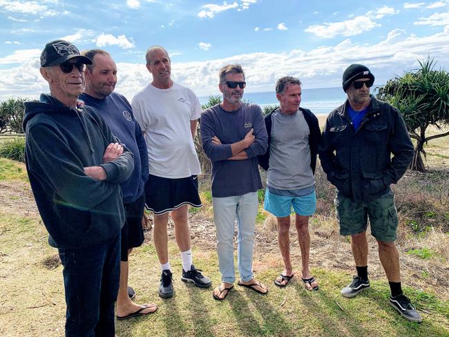 Surfing mates of Rob Pedretti gather at Tugun to remember him.