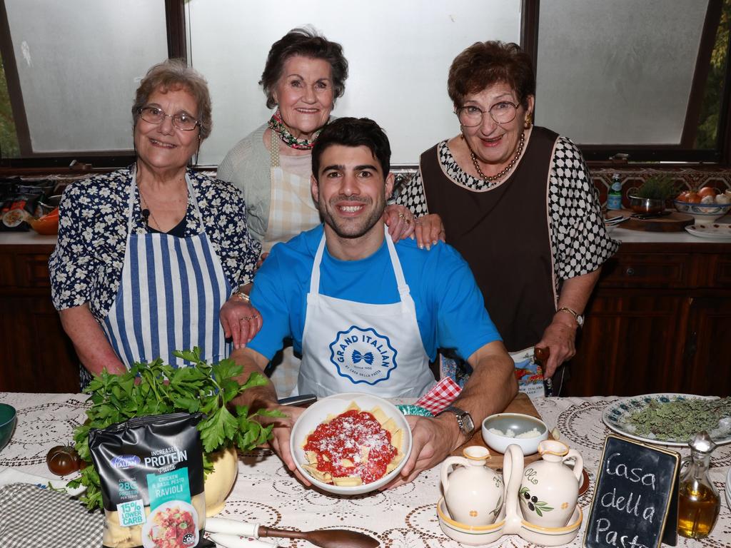 Christian Petracca with some nonnas (L-R) Connie Campori, Margeret Oldham and Vigda Bernau Picture: AFL/Anthony Licuria