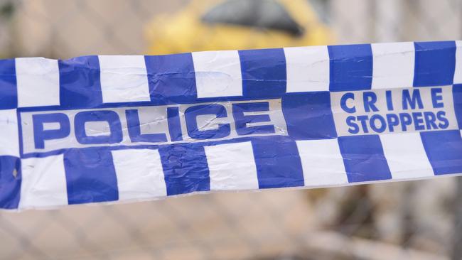 Blue and white Police tape cordoning off a area with a yellow car at a industrial area, Australia 2016 Police tape cordoning off a area with a yellow car - Stock image ipad generic