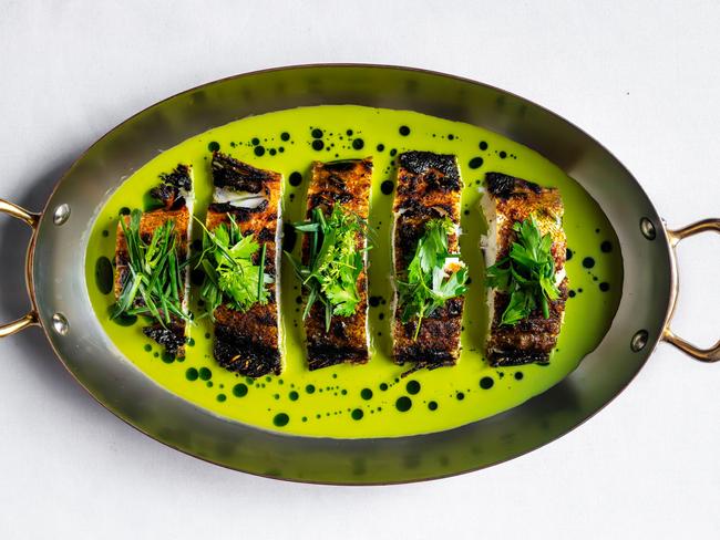 Coal-roasted coral trout in green garlic sauce from Eleven Barrack. Picture: Supplied