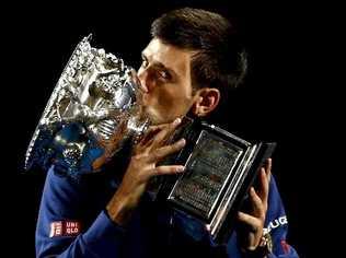 Novak Djokovic of Serbia kisses his trophy after defeating Andy Murray of Britain in the men's singles final at the Australian Open tennis championships in Melbourne, Australia, Sunday, Jan. 31, 2016. Picture: AP Photo - Rafiq Maqbool