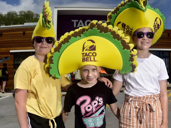 Taco Bell in Townsville has officially opened, attracting a long line of people and cars to the new restaurant. Luella Bright, 10, Poppi Bright, 8 and Mikayla Moore, 10 waiting in line. PICTURE: MATT TAYLOR.