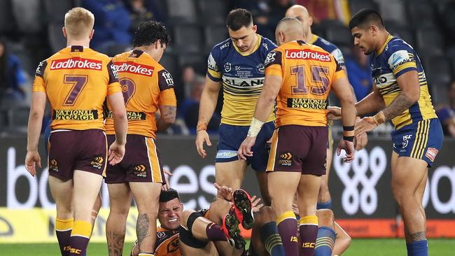 David Fifita reels away in pain after being crushed by Junior Paulo.