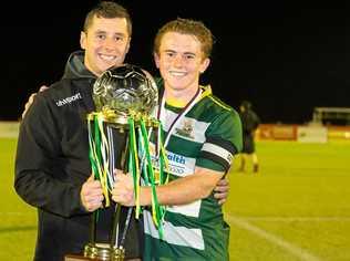 Western Pride coach Graham Harvey and captain Jesse Rigby collect the NPL Queensland grand final trophy. Picture: Chris Simpson