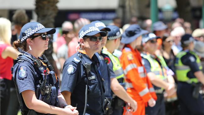 Colour from the Remembrance Day cermony at Anzac Square. There was a heavy police presence. Pic by Luke Marsden.