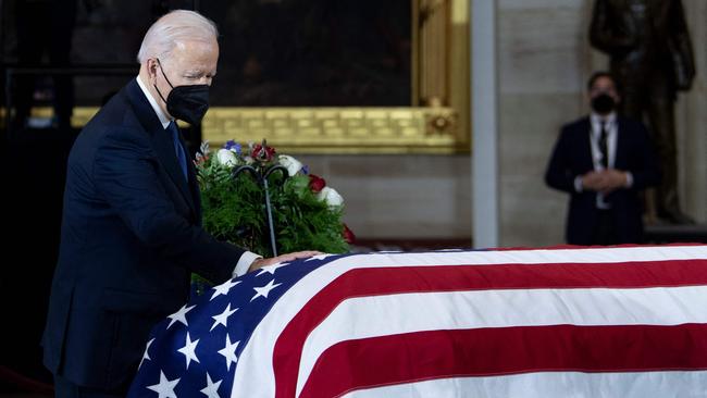 Joe Biden pays his respects to former senator Harry Reid on Capitol Hill on Wednesday. Picture: AFP