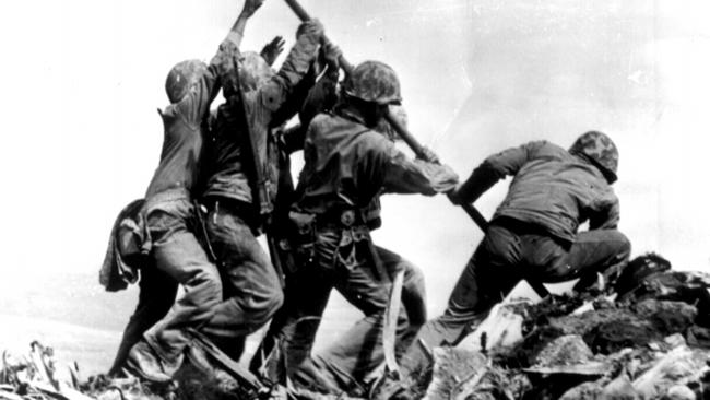 The famous photograph showing a group of US Marines raising the US flag atop Mount Suribachi on Iwo Jima.