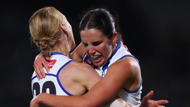 MELBOURNE, AUSTRALIA - NOVEMBER 08: Bella Eddey of the Kangaroos celebrates with Kate Shierlaw of the Kangaroos after kicking a goal during the AFLW Qualifying Final match between North Melbourne Kangaroos and Adelaide Crows at Ikon Park, on November 08, 2024, in Melbourne, Australia. (Photo by Daniel Pockett/Getty Images)