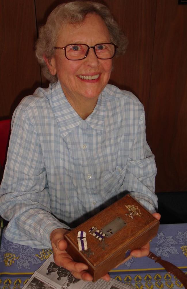 Barbara Woodward, 90, holding the original box her father used during WWI. On his box is his military cross with two bars - a very rare honour.