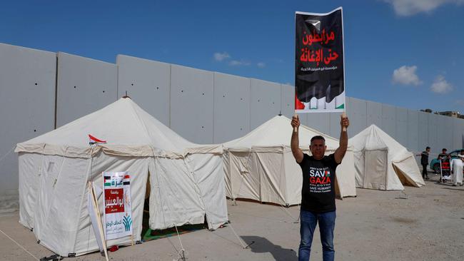 Palestinians in war-torn Gaza on October 19 eagerly awaited the arrival of aid trucks promised in a deal struck by US President Joe Biden, as Israel's military kept up its bombardment of targets in the Hamas-run enclave. Picture: Kerolos Salah/AFP