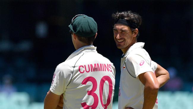 Australia's Mitchell Starc (right) talks to Pat Cummins during day five. Picture: AFP