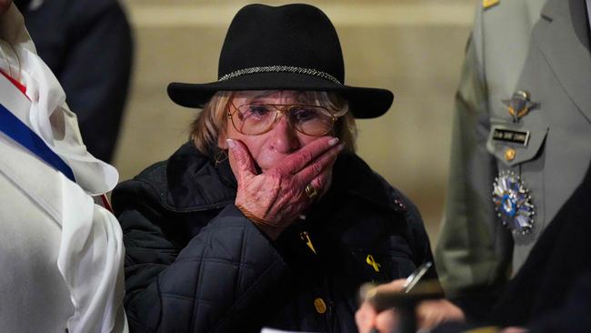 French holocaust survivor and president of the Auschwitz Deportees' Union Arlette Testyler reacts as she takes part in the Rekindling the Flame ceremony at the Tomb of the Unknown Soldier at the Arc de Triomphe in Paris. Picture: AFP