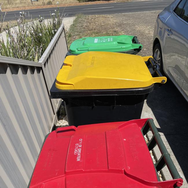 Bendigo bins: red for household waste, yellow for recycling, green for compost.