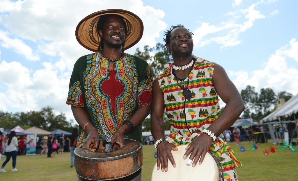 L-R Tichawona Mashawa from Zimbabwe and Adama Doumbouya from Ivory Coast at the Cultural Festival held at the Heritage Village on Sunday. Photo: Chris Ison / The Morning Bulletin. Picture: Chris Ison