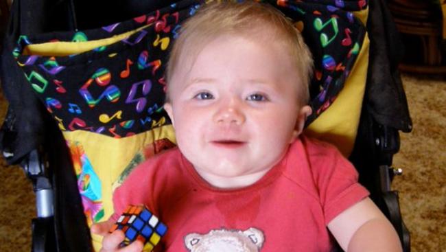 Khandalyce in her stroller with the distinctive quilt later found with her body.