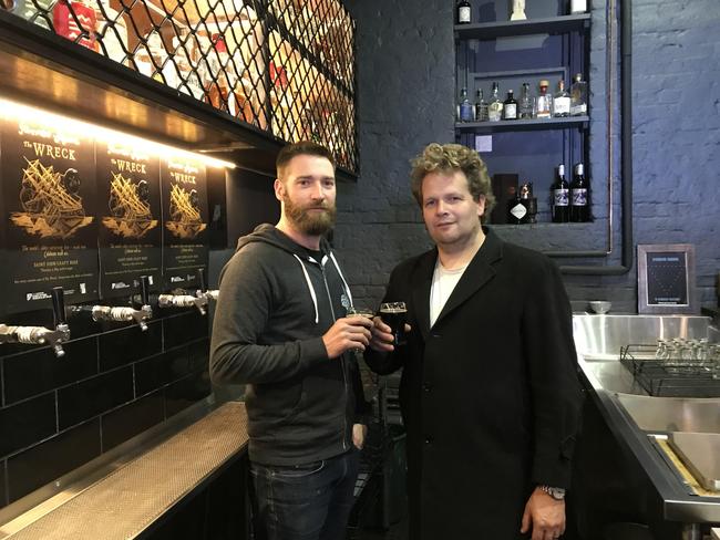 Saint John Craft Beer Bar co-owner Ryan Campling, left, and QVMAG conservator David Thurrowgood taste The Wreck Preservation Ale. Picture: NICK CLARK