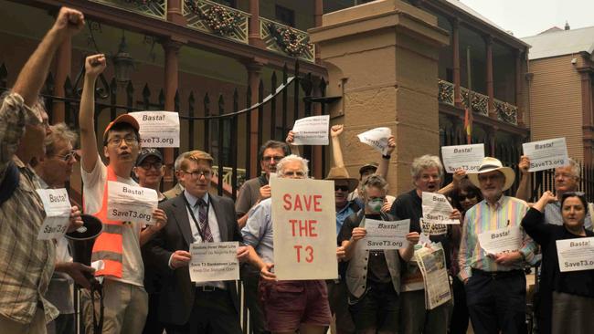 Supporters of the Save the T3 Bankstown Line rally in front of the NSW parliament.