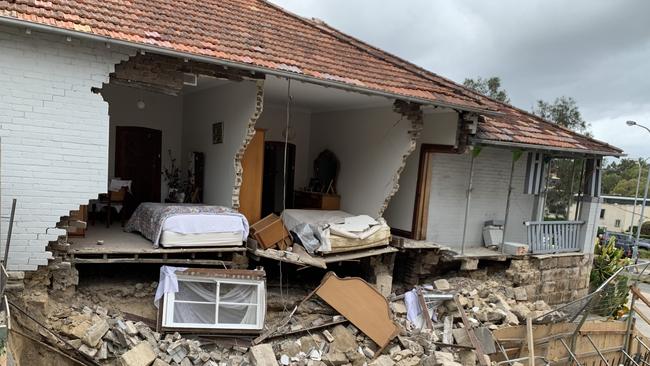 The side of a home collapsed into a neighbouring building site.