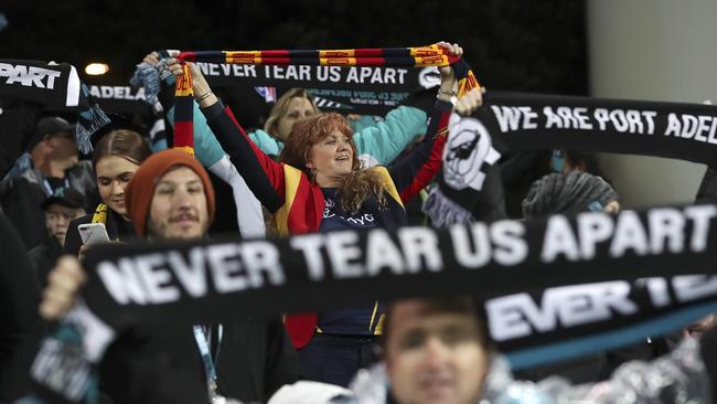 Port and Crows fans at one of this year’s Showdowns. Can the clubs win back their faith? Picture SARAH REED