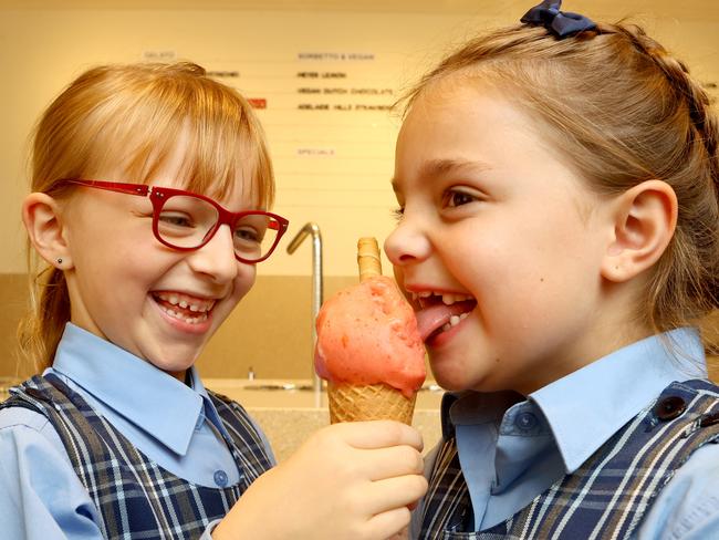 21/05/2021: Rebecca Felcher (7) and Harper North (7) enjoying a gelato at Bottega Gelateria new store in Glenelg. Picture: Kelly Barnes