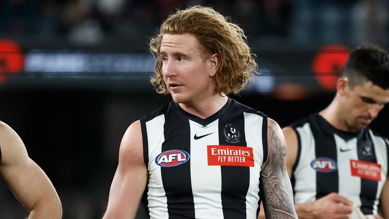 MELBOURNE, AUSTRALIA - AUGUST 18: Taylor Adams (left) and Beau McCreery of the Magpies look dejected after a loss during the 2023 AFL Round 23 match between the Collingwood Magpies and the Brisbane Lions at Marvel Stadium on August 18, 2023 in Melbourne, Australia. (Photo by Michael Willson/AFL Photos via Getty Images)