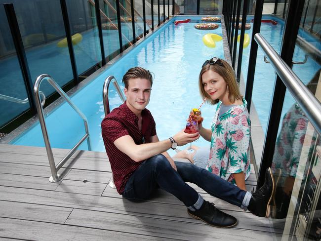 As part of the MFWF, Adelphi Hotel will throw the ultimate pool party on the iconic rooftop pool. Jack Beran and Jacqueline Gillies enjoy a drink pool side. Picture: Andrew Tauber