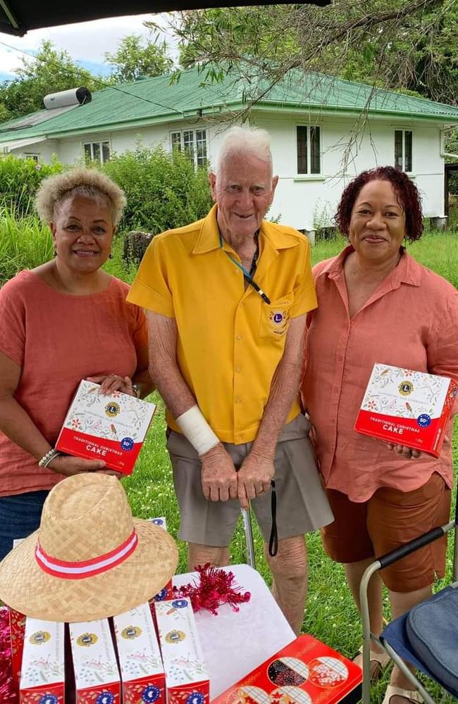 Ray Burt selling Christmas cake on Burwood Rd. Picture: Enoggera Lion’s Club