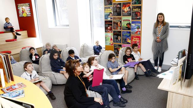Children taking a class while sitting in beanbags.