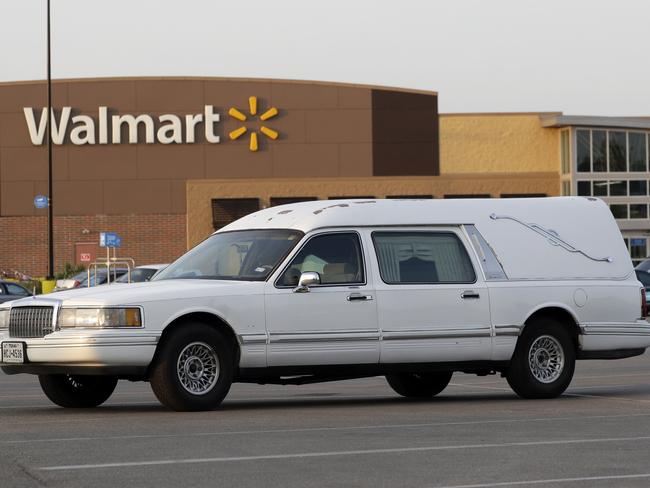 A hearse sits in the parking lot outside Walmart store after eight people were found dead in what police are calling a horrific human trafficking case. Picture: Eric Gay/AP