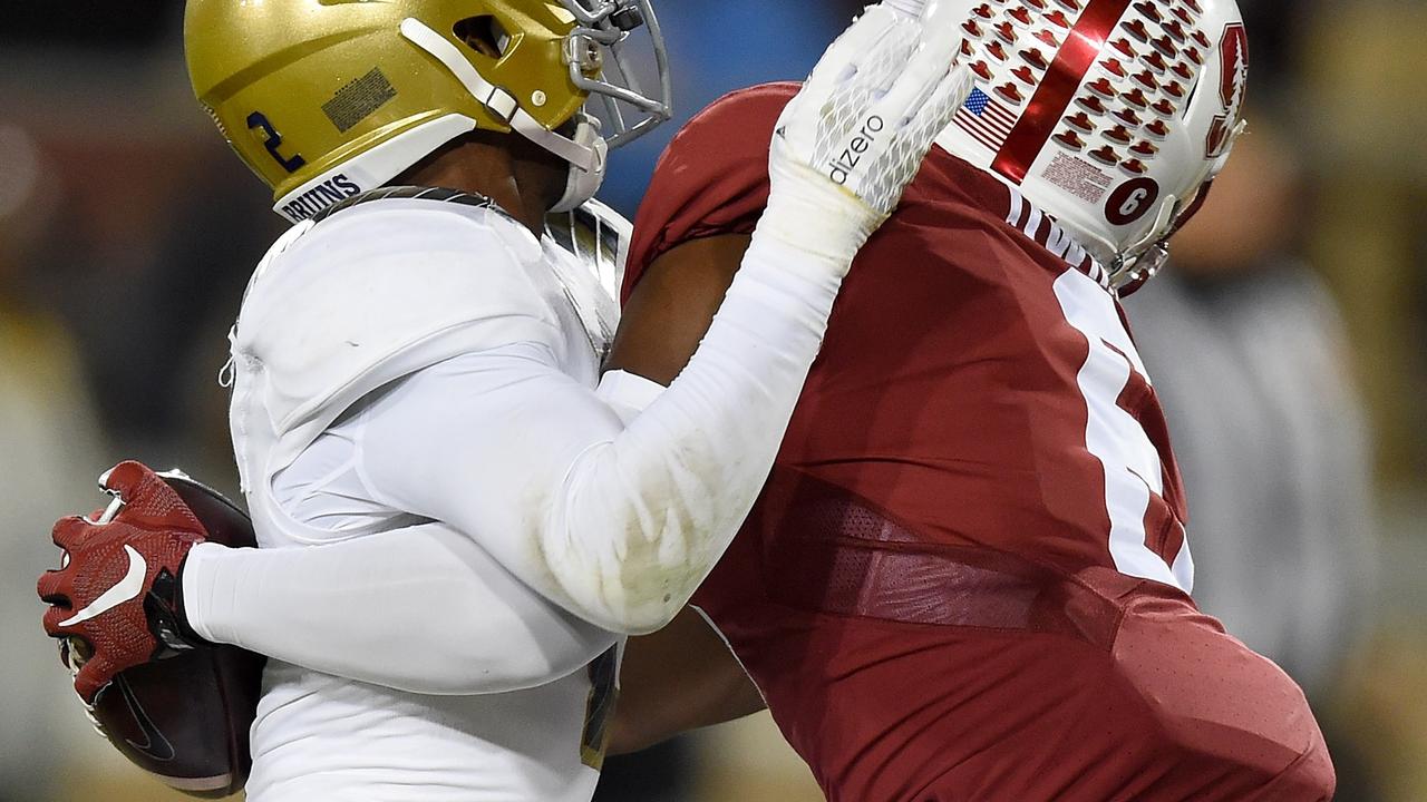 PALO ALTO, CA - OCTOBER 15: Francis Owusu #6 of the Stanford Cardinal's catches a touchdown pass up against the back of Jaleel Wadood #2 of the UCLA Bruins in the third quarter of an NCAA football game at Stanford Stadium on October 15, 2015 in Stanford, California. Thearon W. Henderson/Getty Images/AFP == FOR NEWSPAPERS, INTERNET, TELCOS & TELEVISION USE ONLY ==