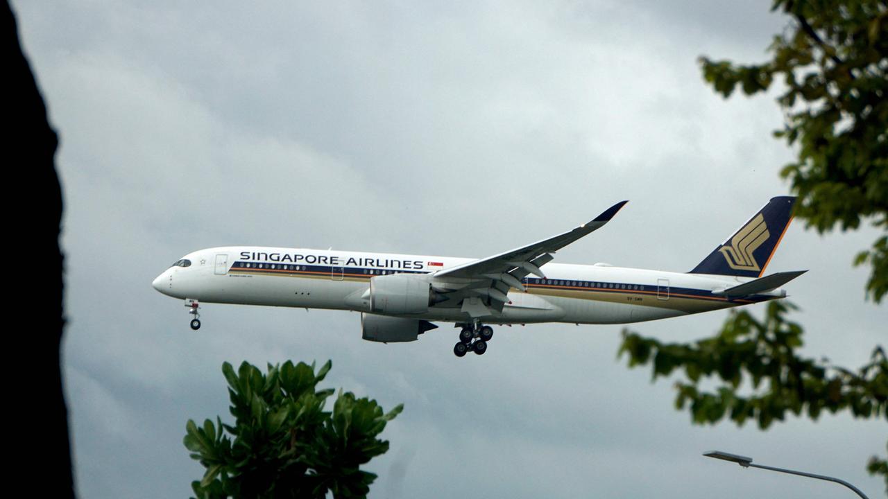 A Singapore Airlines plane prepares to land at Changi International airport as the country eases travel restrictions. Picture: AFP