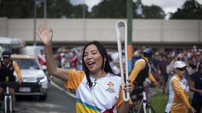 Dami Im carrying the Baton at the Daisy Hill Koala Centre en route to the Commonwealth Games on the Gold Coast.