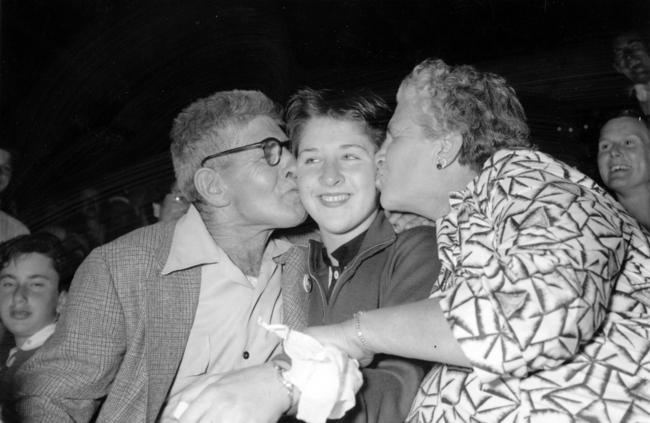 With her parents after she had won her first Olympic Games gold medal in the 100m at the Melbourne Olympics in 1956.