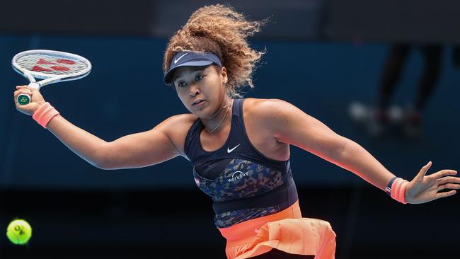 Japan's Naomi Osaka hits a return against Spain's Garbine Muguruza during their women's singles match on day seven of the Australian Open