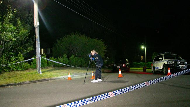 Forensic police and detectives at the crime scene. Picture: Damian Hoffman