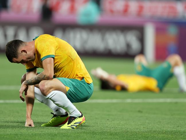 DOHA, QATAR - APRIL 18: Jordan Courtney-Perkins of Australia reacts after losing against Indonesia during the AFC U23 Asian Cup Group A match between Indonesia and Australia at Abdullah Bin Khalifa Stadium on April 18, 2024 in Doha, Qatar.(Photo by Mohamed Farag/Getty Images)