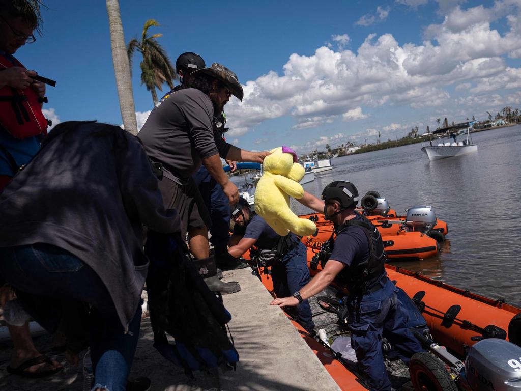 US Coast Guard personnel evacuate people in the aftermath of Hurricane Ian in Matlacha, Florida. Picture: AFP