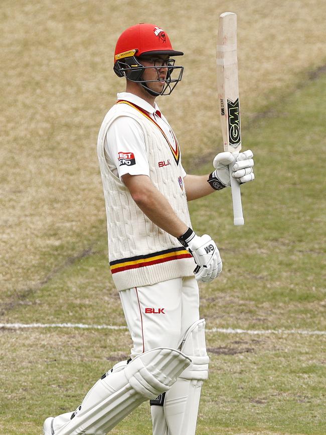 Conor McInerney celebrates a half century on his way to his highest first-class score on Monday. Picture: AAP Image/Daniel Pockett