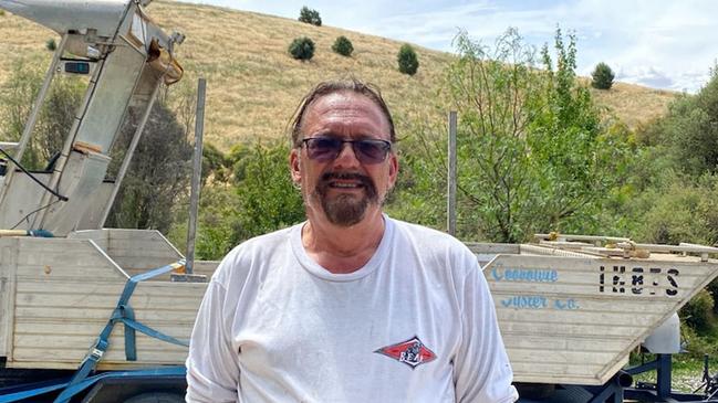 Mark Aldridge with the boat he bought from fundraising to help him rescue kangaroos and other wildlife from the River Murray floods.