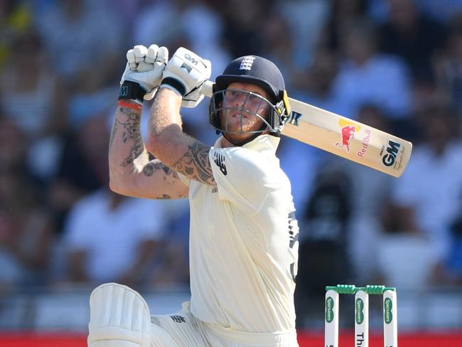 LEEDS, ENGLAND - AUGUST 25: England batsman Ben Stokes hits a ball for 6 runs watched by Tim Paine during day four of the 3rd Ashes Test Match between England and Australia at Headingley on August 25, 2019 in Leeds, England. (Photo by Stu Forster/Getty Images)