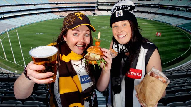 Plastic beer cups, such as the one held by Hawthorn fan Nicole Menzel, could be phased out. Picture: