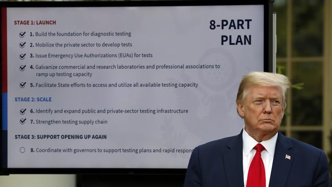 President Donald Trump listens during briefing about the coronavirus in the Rose Garden of the White House on Monday. Picture: Alex Brandon/AP