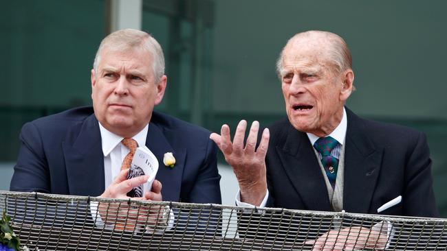 Prince Philip, Duke of Edinburgh and Prince Andrew, Duke of York watch the racing from the balcony of the Royal Box as they attend Derby Day during the Investec Derby Festival at Epsom Racecourse on June 4, 2016 in Epsom, England. Picture: Getty