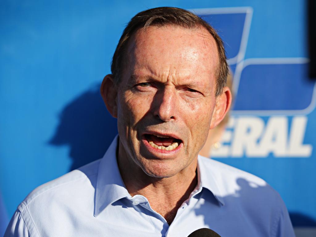 Mr Abbott talks to reporters while voting at Forestville Public School in his electorate of Warringah. Picture: AAP/Adam Yip