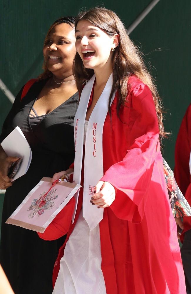 Suri appeared giddy as she met her fellow graduates. Picture: BrosNYC / BACKGRID