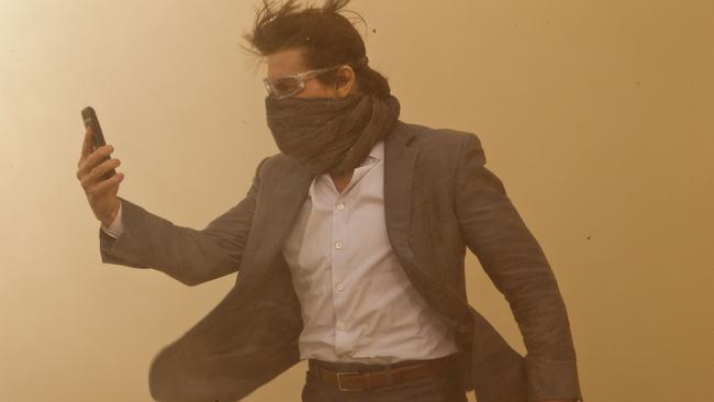 Tom Cruise caught in a Dubai sand storm in a scene from film Mission: Impossible — Ghost Protocol.