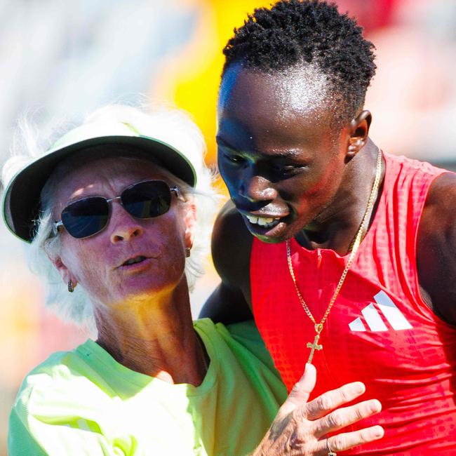 Australia's Gout Gout celebrates with his coach Diane Sheppard after winning the men's 200m final.