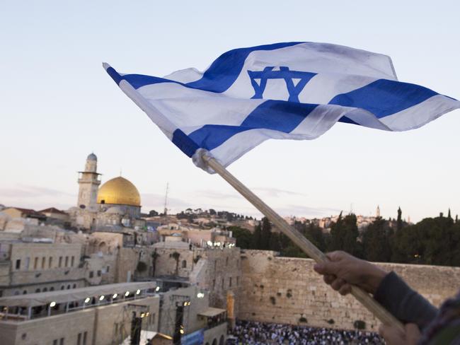 JERUSALEM, ISRAEL - MAY 13:  (ISRAEL OUT) Israelis wave their national flags during a  march next to the Western Wall on May 13, 2018 in Jerusalem, Israel. Israel mark Jerusalem Day celebrations  the 51th anniversary of its capture of Arab east Jerusalem in the Six Day War of 1967. One day before US will move the  Embassy to Jerusalem.  (Photo by Lior Mizrahi/Getty Images) *** BESTPIX ***